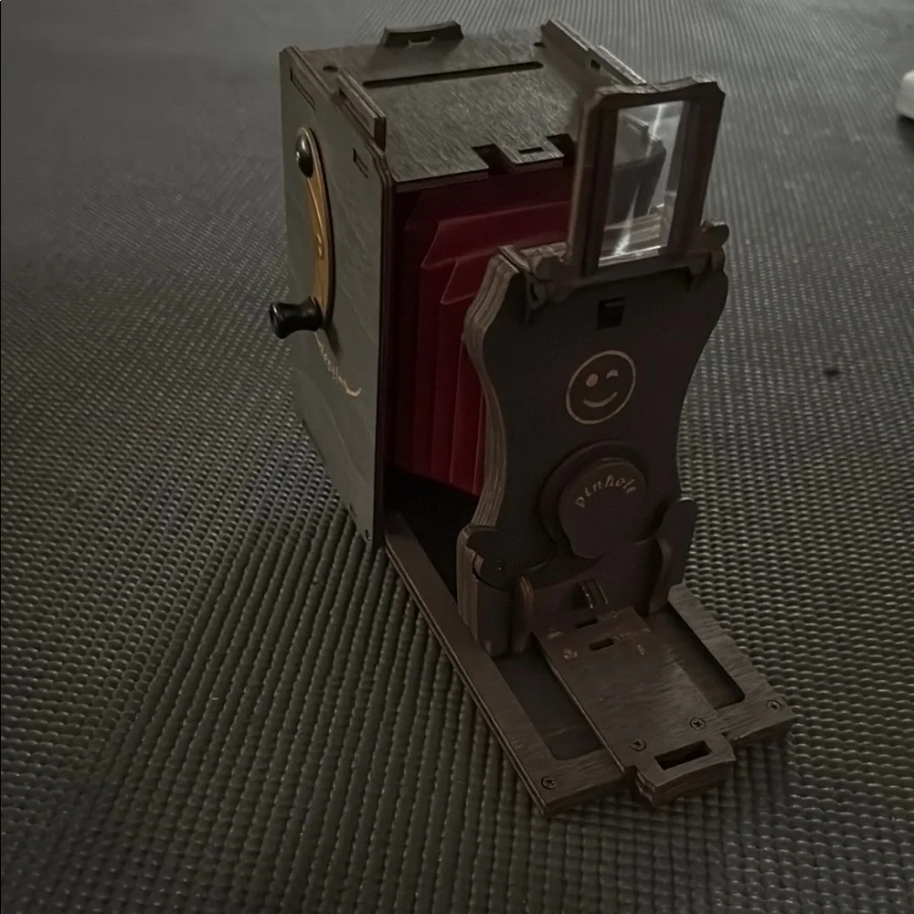 Red and Brown Simulated Camera with Vintage Aesthetic